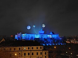 Planets floating above the Lublin Castle as a Rebel Moon advertisement