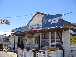 A general store in Scarsdale, Victoria, Australia operates as a post-office, newsagent, petrol station, video hire, grocer and take-away food retailer. This type of store is referred to locally as a milk bar.