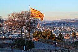 The flag of Catalonia flying on the Montjuïc Castle, Barcelona
