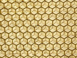 Commercial honeycomb foundation, made by pressing beeswax between patterned metal rollers