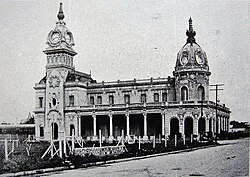 The Mar del Plata Sud railway station (c.1910) closed in 1949 and was later damaged by fire. It underwent a major restoration in the 2010s, but the upper part, which lost its decoration after the fire, remains unadorned.