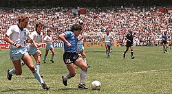 Maradona right before scoring the "Goal of the Century" (four minutes after his "Hand of God" goal) against England in Mexico 1986. In 2022, his shirt sold for £7.1 million ($9.3 million), the highest for a piece of sports memorabilia.[116]