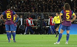 Villa's season comes to an end as he is carried off on a stretcher after breaking his tibia at the 2011 FIFA Club World Cup.