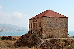Traditional Lebanese house overlooking the Mediterranean sea, Byblos. This house is within the antiquities complex and illustrates the modern ground level concerning excavations