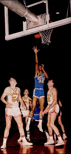 Lew Alcindor (blue), now Kareem Abdul-Jabbar, against the USC Trojans in the 1966–67 season.