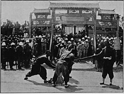 French troops observe the execution of a Boxer