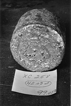 A uranium metal "biscuit" created from the reduction reaction of the Ames process