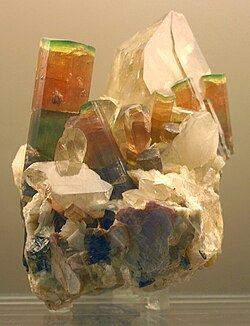 Tri-chromatic elbaite crystals on quartz, Himalaya Mine, San Diego Co., California, US
