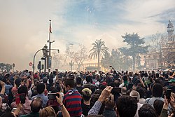 Locals and tourists watching the traditional "mascletà" during Falles