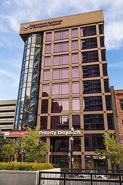 The former location of the Deseret News on Regent Street. The newspaper's logotype was carved into the top of the building's façade (since filled in by its new tenant) to give the building the appearance of the newspaper.