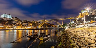 View during the blue hour of the Luiz I Bridge and the city of Porto.
