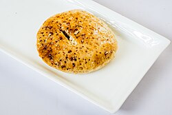 The Bakarkhani flatbread cookie is part of Mughlai cuisine of the Indian subcontinent.