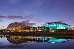 The OVO Hydro arena (right) is the second-busiest arena venue in the world. The SEC Armadillo is located to its left[198]