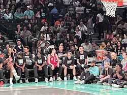 Players from the Las Vegas Aces in September 2024, wearing T-shirts that read VOTE.