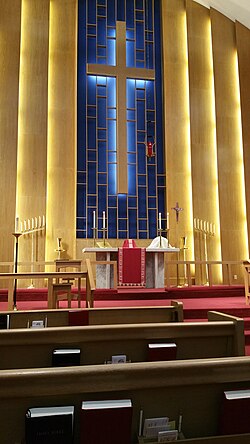 The chancel of a Lutheran church decorated with red paraments, the liturgical colour of the last week of Lent, Holy Week, in the Lutheran and Anglican Churches[177]