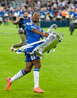 Didier Drogba holding the Champions League trophy after Chelsea's victory in 2012