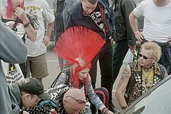 Punk with a red mohawk at Holidays In The Sun Festival in Morecambe, England, in 2003