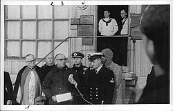 On Deception Island, President Arturo Frondizi gives a speech that is broadcast by radio.