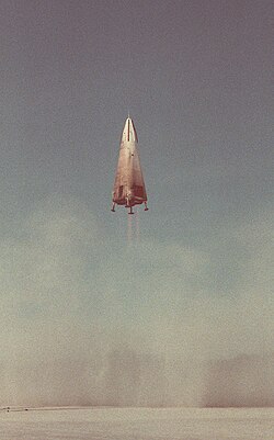 The DC-X, shown during its first flight, was a prototype single-stage-to-orbit vehicle, and used a biconic shape similar to AMaRV.