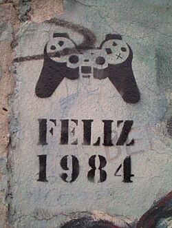 "Happy 1984" in Spanish or Portuguese, referencing George Orwell's novel Nineteen Eighty-Four, on a standing piece of the Berlin Wall (sometime after 1998)