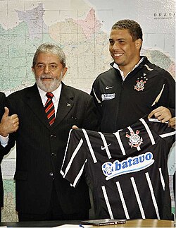 Ronaldo during his Corinthians unveiling in 2009, with Brazil president Lula handing him the jersey
