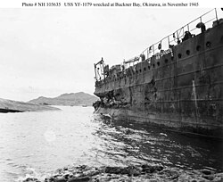 YF-1079 (right) and a sunk ship, possibly YF-757, (left) in Nakagusuku Bay