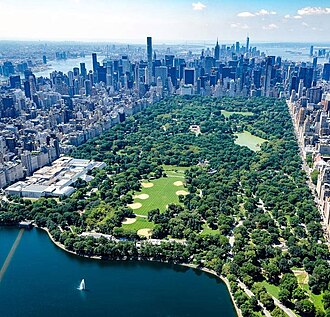 Central Park, one of the world's most visited tourist attractions,[1] is surrounded by the skyscrapers of Manhattan in New York City.