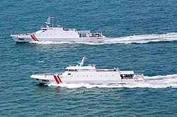 Two patrol ships of the Indonesian Maritime Security Board during a patrol.