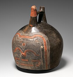 Ceramic Bottle with Feline Face, 4th–3rd century BCE. The face of a snarling feline decorates the side of the vessel chamber, directly under the whistle spout.[1]