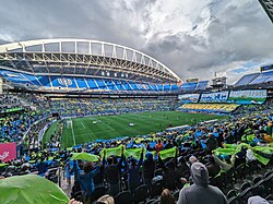 A view of a soccer field from high in the crowd before a match
