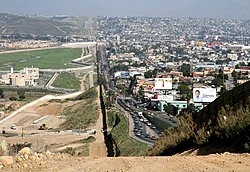 The Mexico–United States barrier between San Diego's border patrol offices in California, US (left) and Tijuana, Mexico (right)