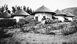 The earliest urban dwelling typically made up of hut cluster. Here is an example of British legation pictured in 1910.