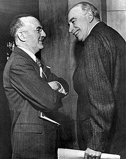 The economists Harry Dexter White (left) and John Maynard Keynes (right) at the Bretton Woods Conference in New Hampshire[19]