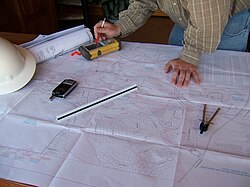 Image shows civil engineers working/planning on a site