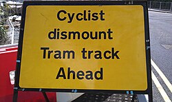 Tram tracks pose a hazard for cyclists, as their wheels may get caught in the track.