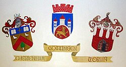 Coats of arms of twin towns of Cheltenham, Göttingen and Toruń