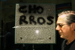 The word chorros (Lunfardo term meaning "thieves") graffitied on the wall of a BNL bank in Buenos Aires, during protests against Corralito, 2002