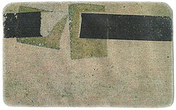 The first prototype of magnetic stripe card created by IBM in the late 1960s. A stripe of cellophane magnetic tape is fixed to a piece of cardboard with clear adhesive tape