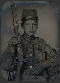 Sergeant William T. Biedler, 16 years old, of Company C, Mosby's Virginia Cavalry Regiment with flintlock musket. From the Library of Congress Prints and Photographs Division.