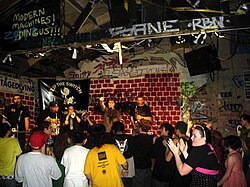 A band plays on the tiny stage at the Berkeley, California punk venue at 924 Gilman Street