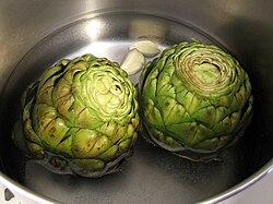 Globe artichokes being cooked