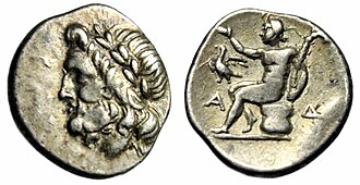 A silver triobol of the Arcadian League from ancient Megalopolis. The head of Zeus on the obverse, Pan seated on the reverse.