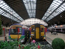 High level platforms with trains in former ScotRail National Express livery (2005)