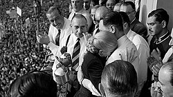 Perón embraces her husband during the 1951 joint ticket rally, unable to accept popular calls that she run for vice-president.