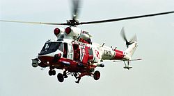 A Polish Navy W-3 Sokół SAR helicopter hoists a crew member