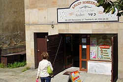 Kosher shop in Warsaw, using the Polish spelling of "kosher"