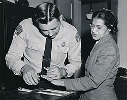 Rosa Parks being fingerprinted after being arrested for not giving up her seat on the bus to a white person