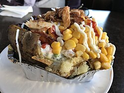 A Turkish kumpir with several toppings