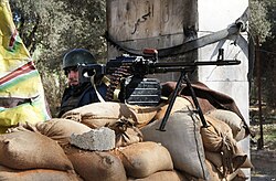 A Syrian soldier manning a checkpoint near Damascus.