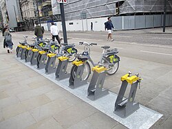 Electric rental bicycles are now widespread throughout the city.